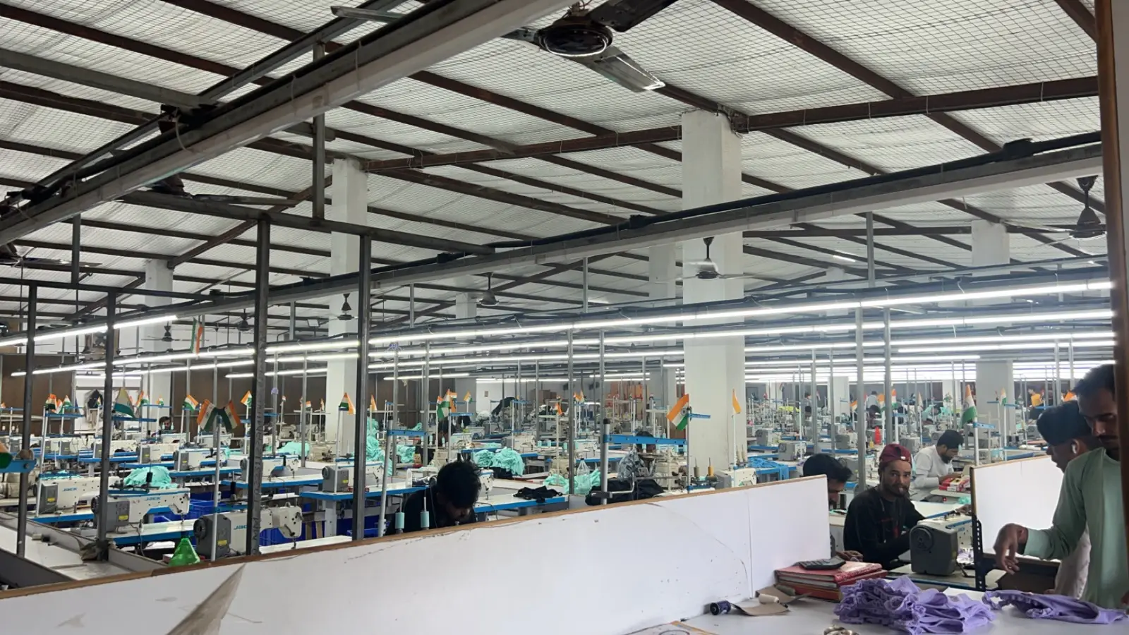Knitting machines running on the ChillCare Apparels production floor